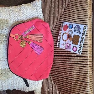 Estee Lauder red cosmetic bag, with printed detail and bonus stickers